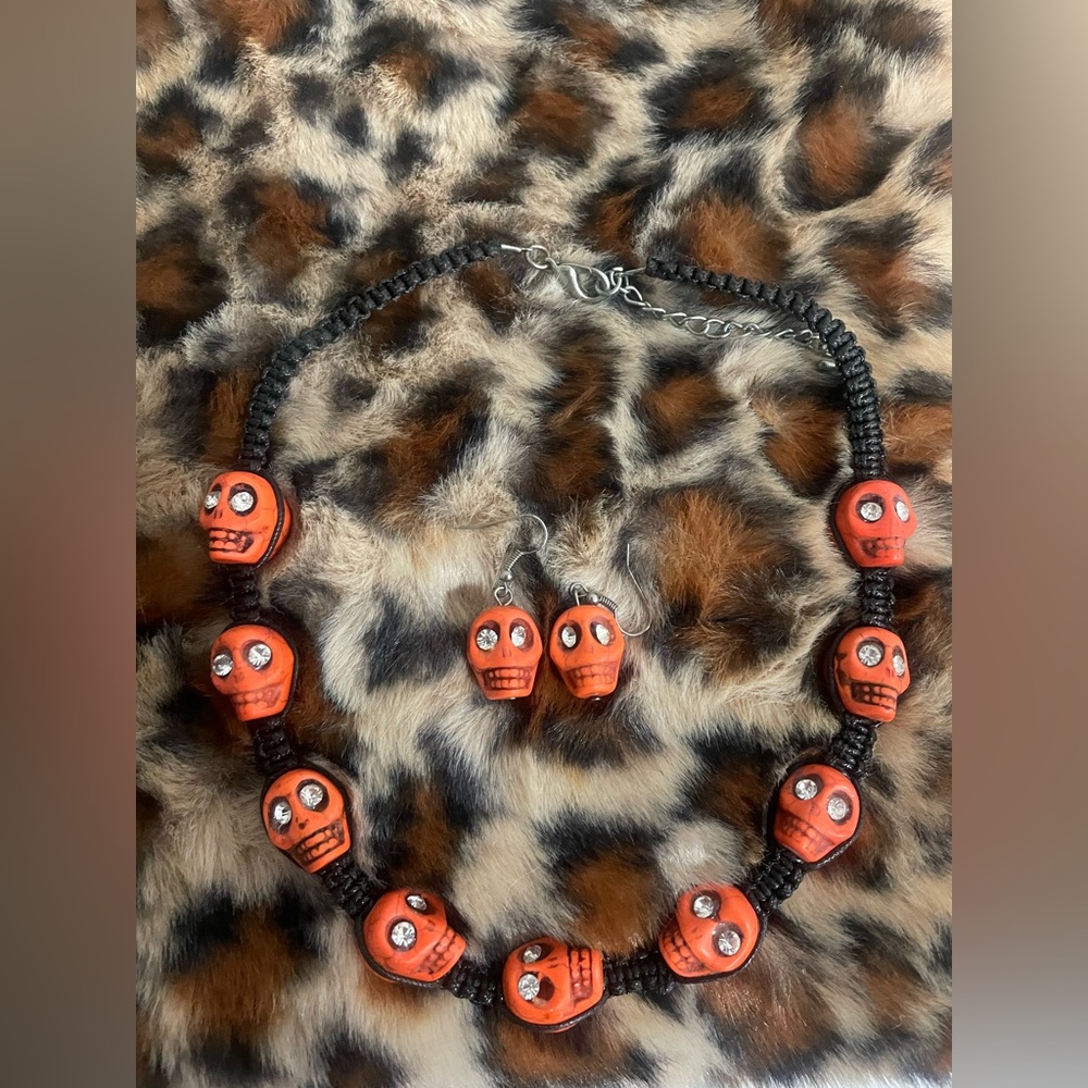 Skull necklace & earrings. Orange & black w rhinestone eyes.